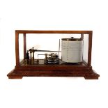 An oak cased barograph, together with a selection of charts (2)