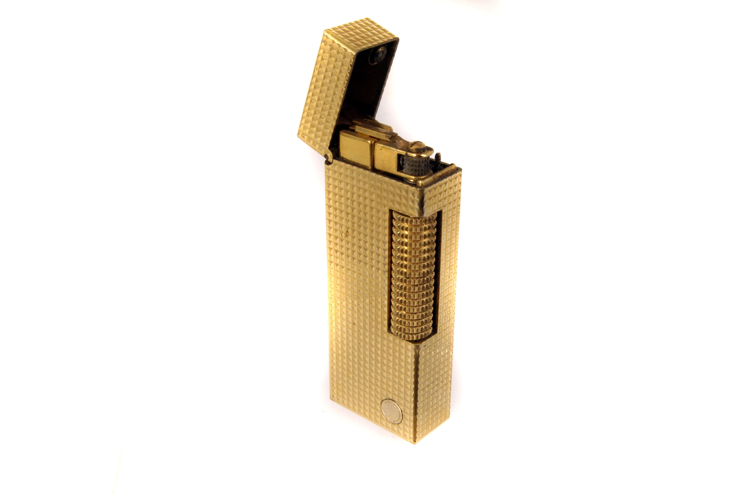 A gold plated Dunhill Rollagas lighter, with hobnail engine turned decoration