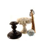 A small collection of works of art, including a glass paperweight, hardstone urn and candle stick, a