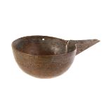 An unusual 19th century Middle Eastern copper pouring bowl, having engraved designs, including