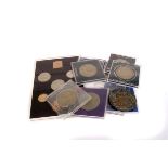 An assortment of various crowns and proof sets, including an aviation and space collection, set in
