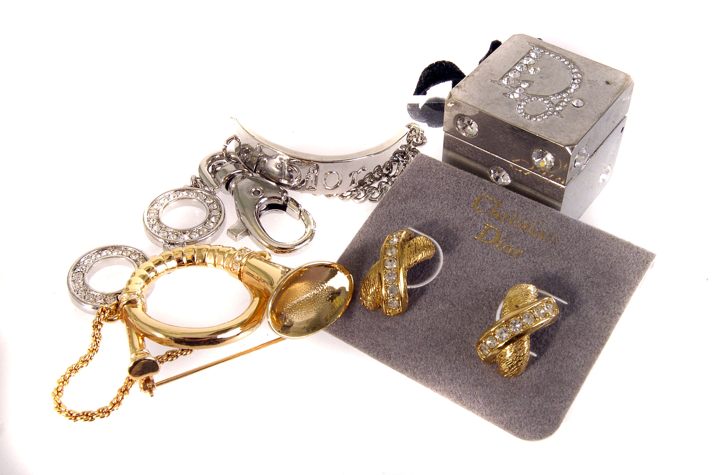 A collection of Christian Dior jewellery, including earrings, pendant on chain, a musical instrument