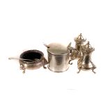 A silver mustard pot, dated London 1893, with family crest together with a silver salt with lion