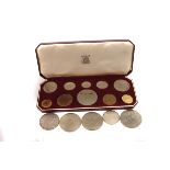 A small collection of British coins, to include a 1953 ten coin proof set, a silver 1977 crown, a