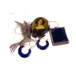 A white metal and porcelain portrait brooch, with transfer printed image of a lady, together with
