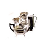 A selection of silver plated items, including an oval serving tray, a tea and coffee pot, a sugar