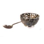 A Chinese silver openwork repousse bowl, the chased and pierced three dragon decoration bowl with