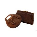 Two lady's crocodile skin handbags, one with crocodile legs attached, also including a crocodile