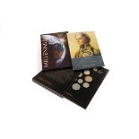 A selection of commemorative coins, including The Millennium £5 coin, Royal Mint Emblems of