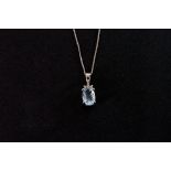 A 9ct white gold and aquamarine pendant necklace, the oval cut stone in four claw mount, on fine 9ct