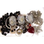 A selection of various costume jewellery, including a VW key ring, a white metal charm bracelet,