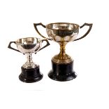 Four silver plated golfing trophies, one for the Armistead Cup 1942, Heale Cup Winner 1943, and