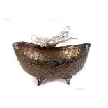 A large silver plated bowl, having embossed and engraved leaf decoration, together with four