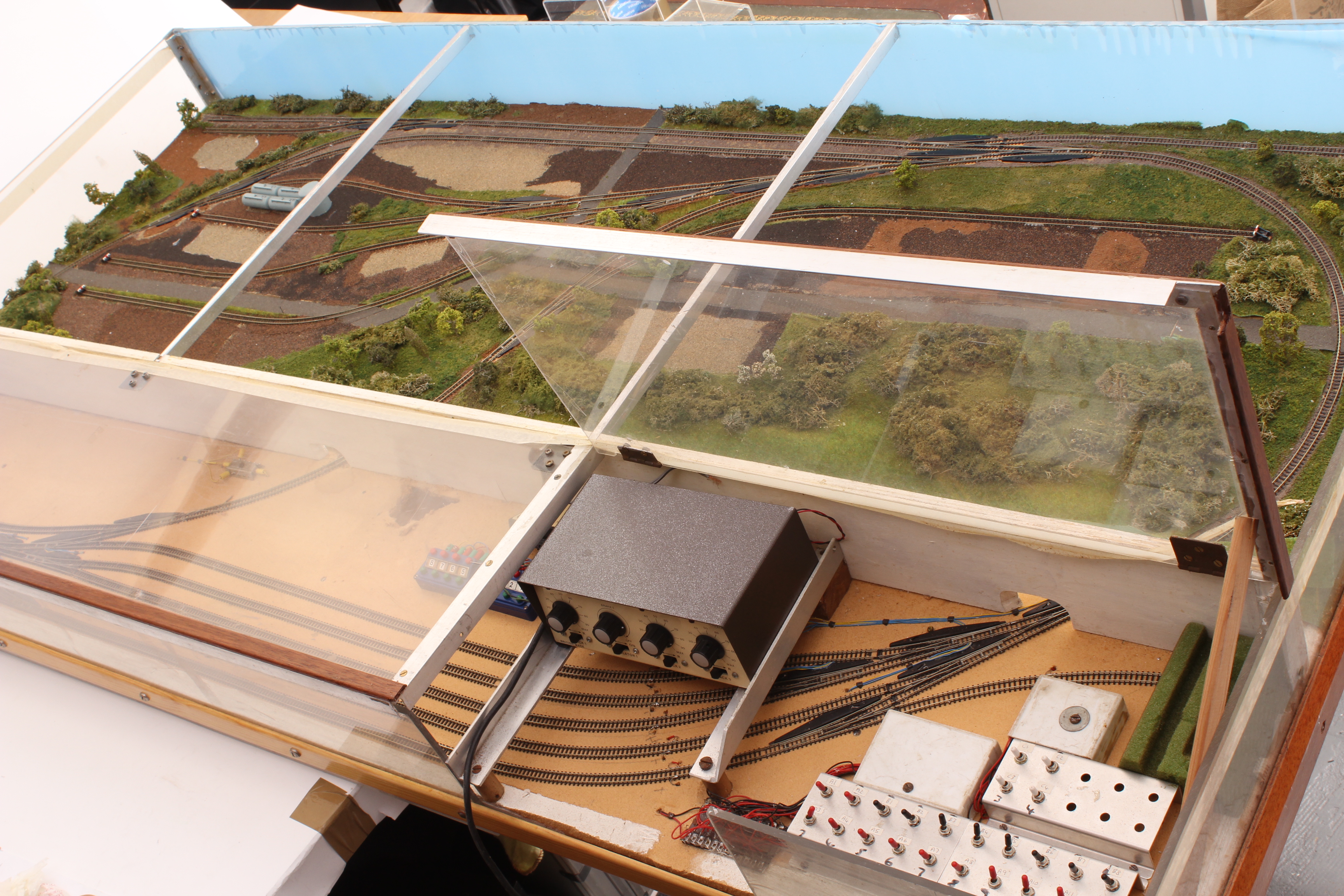 A Z Gauge scratch built Model Railway Layout, built with clear plastic lift up lid with two