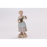 A nineteenth century Meissen figure group, modelled as young lady with a posy, barefoot on rococo