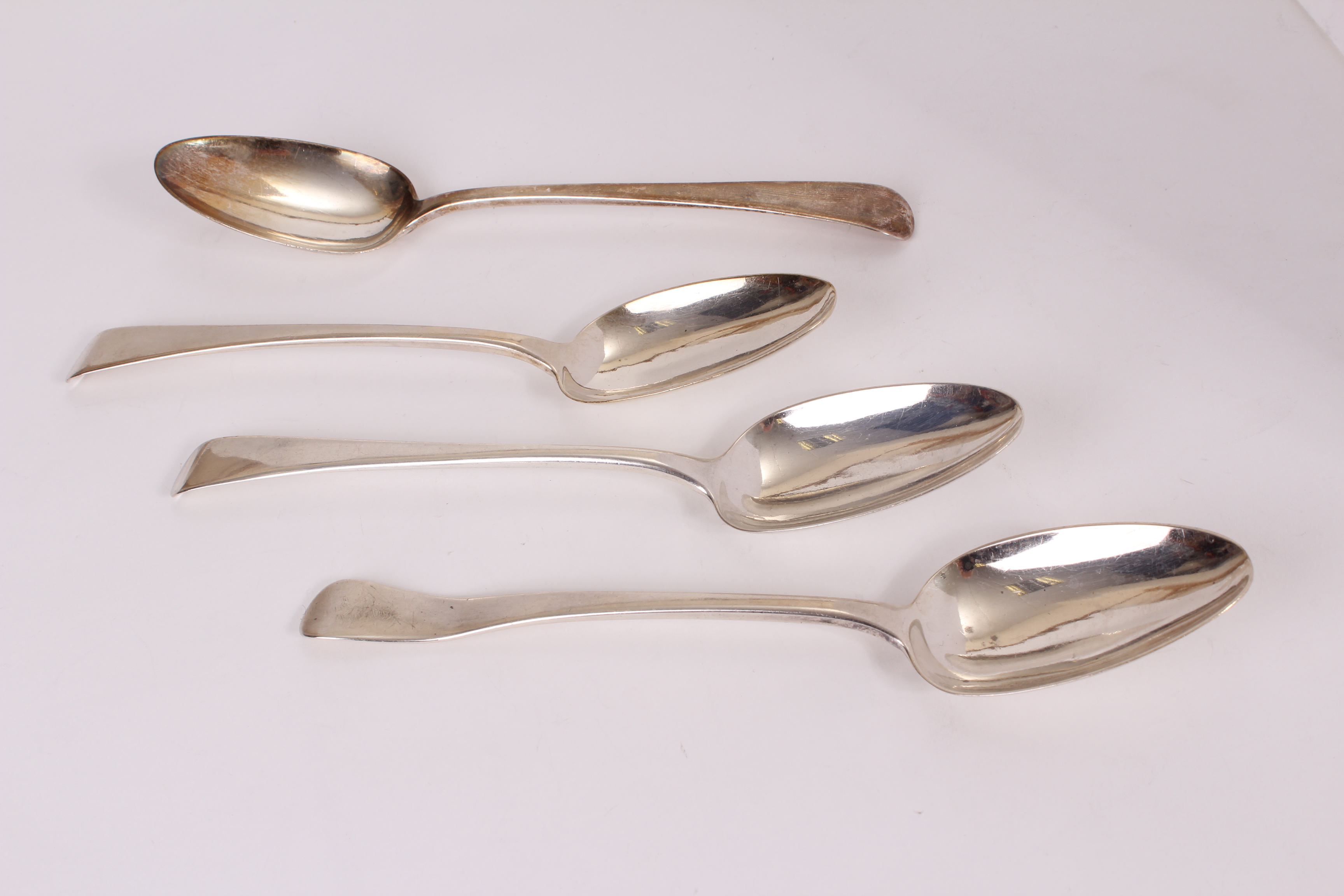 A set of four George III silver tablespoons by Richard Crossley, dated London 1806, one AF (4)