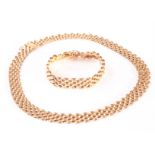 A 9ct gold necklace and bracelet set, having five rows of oblong domed links, hallmarked to clasp,