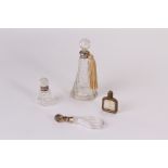 Two silver neck dressing table bottles, a continental silver gilt mounted scent bottle, and a