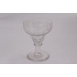 An 18th century etched glasss rummer with basaly faceted pan top, etched with trailing vine and