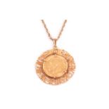 A George V full sovereign pendant, the 1914 dated gold coin with P mint mark, presented in a 9ct