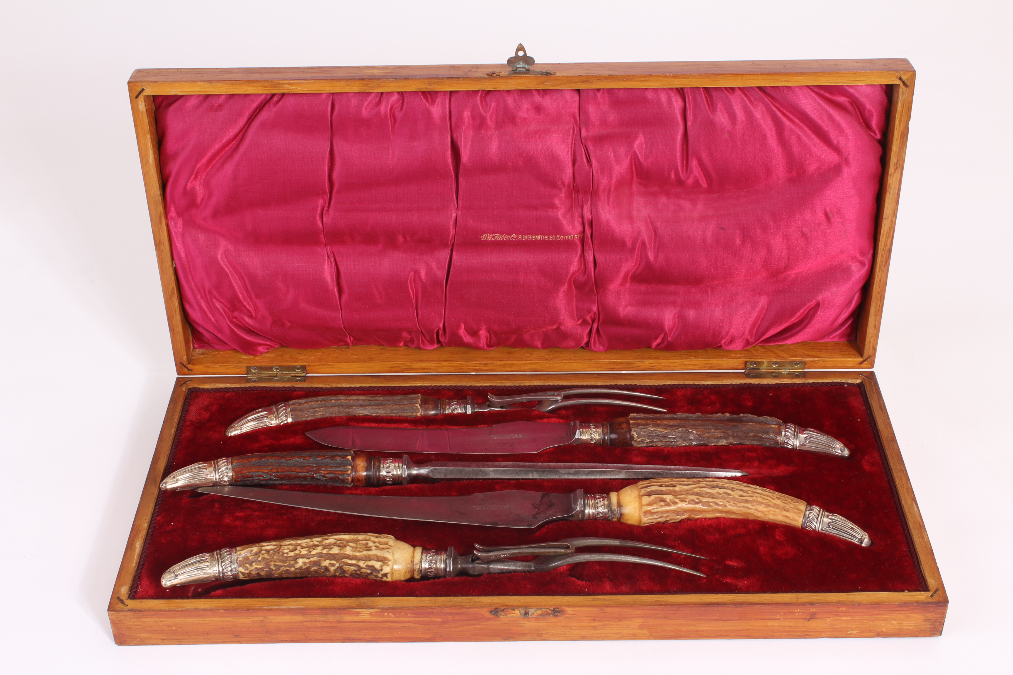 A presentation antler carving set, in oak fitted case containing five utensils with silver collars