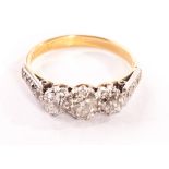 An 18ct gold three stone diamond ring, with approx. 1ct of diamonds set in platinum, beset with