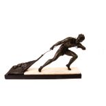 An Art Deco style figure, the spelter and bronzed athletic figure of a fisherman hauling his net,