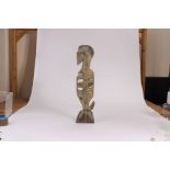 A South Sea Island/Easter Island tribal pipe fish or seahorse devotional carving, in yellows and