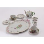 A Herrend porcelain tete-a-tete tea set, comprising tea tray, teapot, sugar basin, jug, four saucers