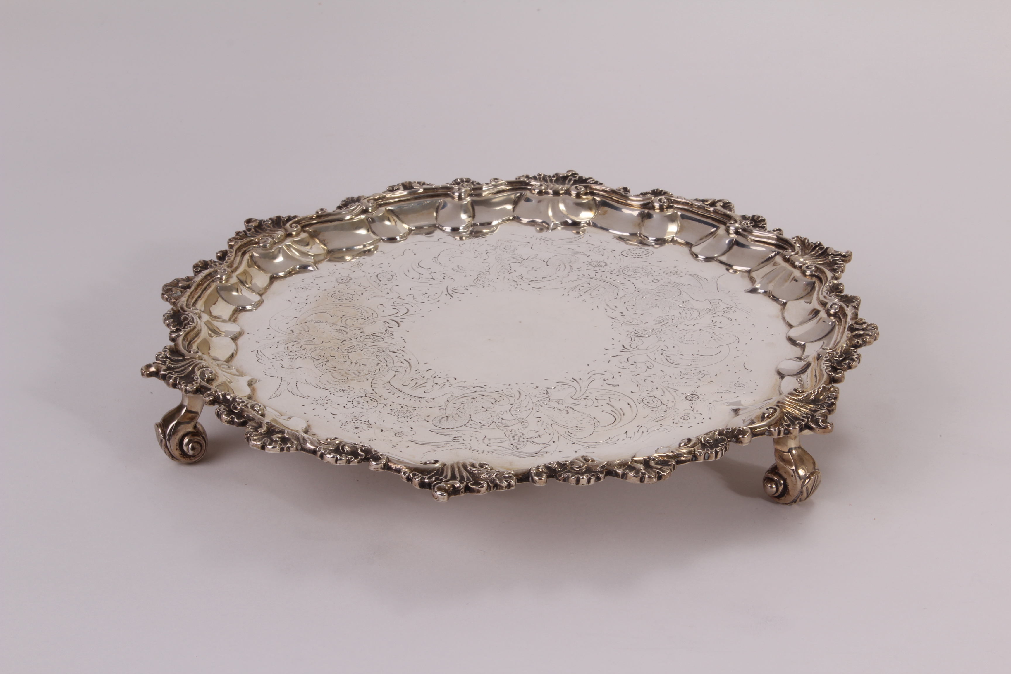 A George IV silver tray by Robert Hennell II, having rococo motif rim, the well engraved with floral