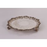 A George IV silver tray by Robert Hennell II, having rococo motif rim, the well engraved with floral