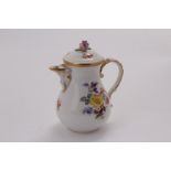 A nineteenth century Meissen hot water jug, with hand painted floral motif, and rosebud knop 15.