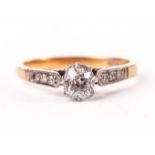 An Edwardian diamond engagement ring, having an old cut stone in platinum claws and platinum