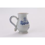 An eighteenth century English porcelain milk jug in the Chinese style, decorated with underglaze