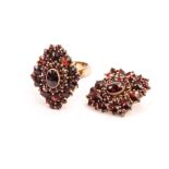 A garnet set ring and pendant, the diamond shaped cluster mounts, possibly from another piece of