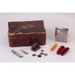 A George V silver cigarette case and other items, including an Art Deco amber cheroot in case, a