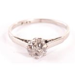 A platinum solitaire diamond ring, with old cut stone 2.5g Notable carbon inclusions to the stone