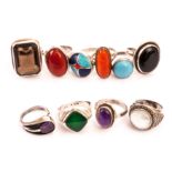 A collection of ten silver dress rings, in varying styles, one with a smoky quartz, one with a