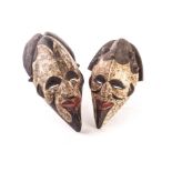 A pair of West African (Gabon) Punu Duma face masks, decorated in pigment and kaolin tc.1915, 43cm H