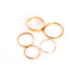 Three 22ct gold wedding bands, including one small Victorian example, approx 7.2g, together with