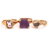 Three gem set dress rings, including an 18ct gold and amethyst signet ring, a 9ct gold and