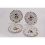 A set of four Nympenburg cabinet plates, decorated with hand painted floral reserves within a