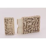 A late 19th century Chinese carved ivory calling card case, intricately decorated with figures in