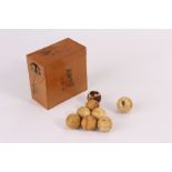 A small group of 19th century ivory miniature billiard balls, still retaining elements of the