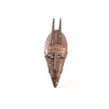 A Marka passport mask c.1920 elongated horned mask covered in hammered brass, from the Marka tribe