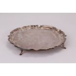 A modern silver tray, having shaped rim and plain well, bearing inscription to underside from the