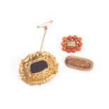 A collection of three memoriam brooches, with hair compartments, one beset with coral 17.4g