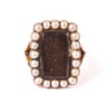 A Victorian gold and pearl mourning ring, having a glazed rectangular plaited hair panel