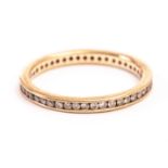 A 9ct gold and diamond full eternity ring, having channel set small brilliant cuts, approx size R