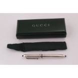 A boxed Gucci fountain pen with 18ct gold nib, and with white metal case marked CDXLI